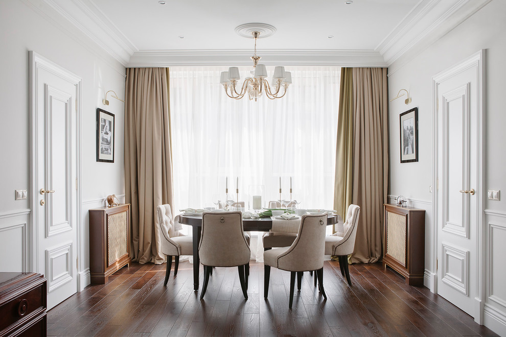 Mid-sized transitional dining room in Moscow with dark hardwood floors, brown floor and white walls.