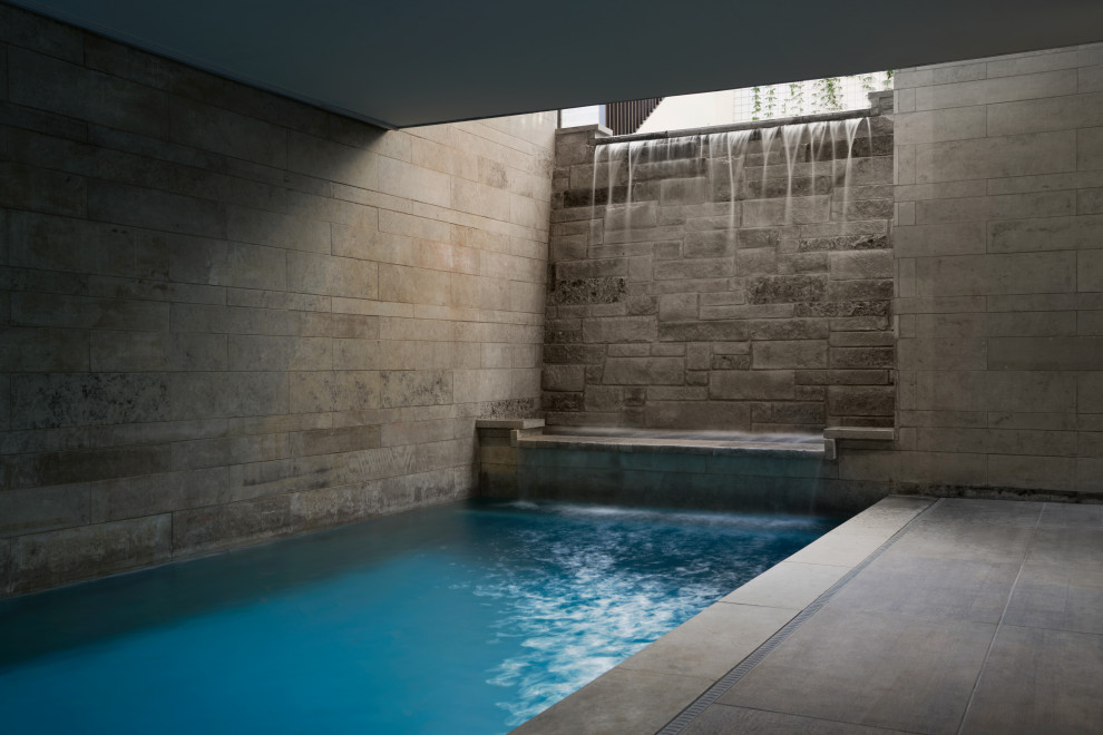 Inspiration for a large modern tile and rectangular lap hot tub remodel in Austin