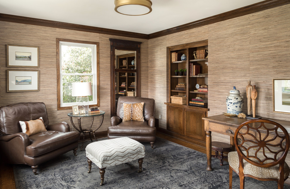 Traditional living room in DC Metro with brown walls, medium hardwood floors and brown floor.