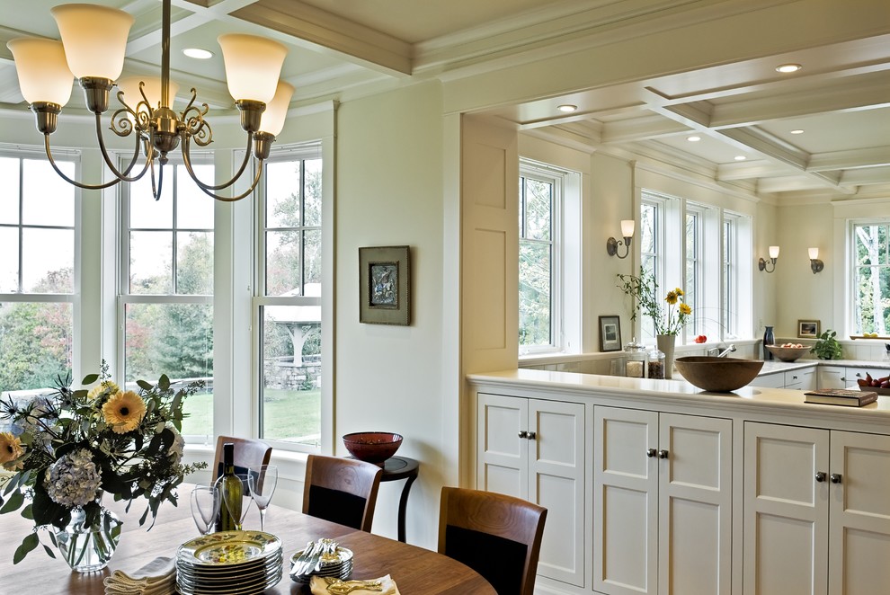 This is an example of a traditional kitchen/dining combo in Burlington with beige walls.