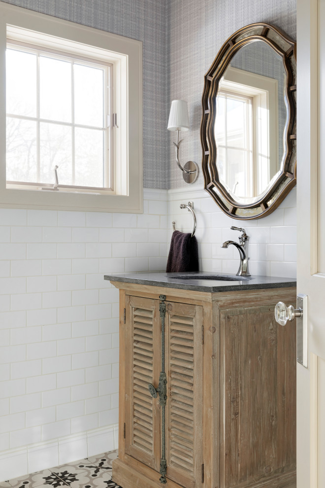Bathroom - mid-sized transitional 3/4 white tile and porcelain tile cement tile floor, multicolored floor, single-sink and wallpaper bathroom idea in Minneapolis with furniture-like cabinets, distressed cabinets, blue walls, zinc countertops, black countertops and a freestanding vanity