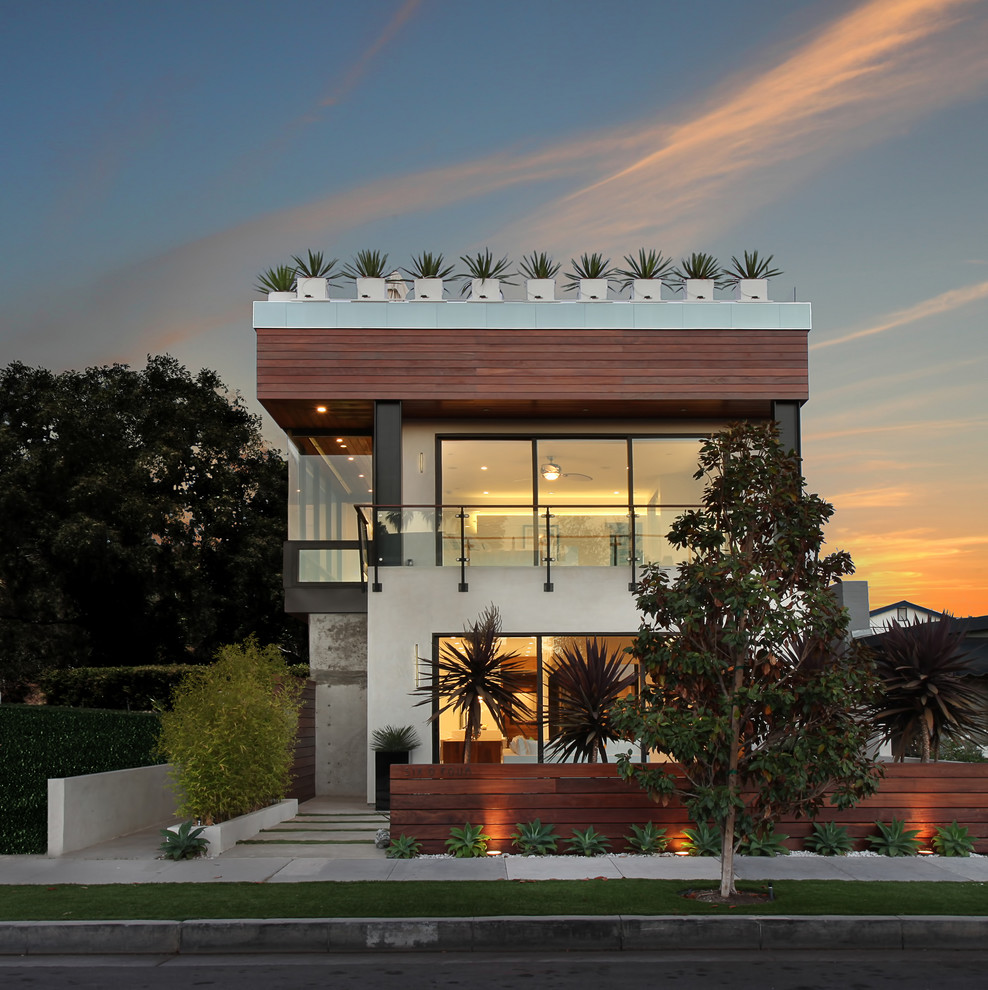 This is an example of a mid-sized contemporary two-storey exterior in Orange County.