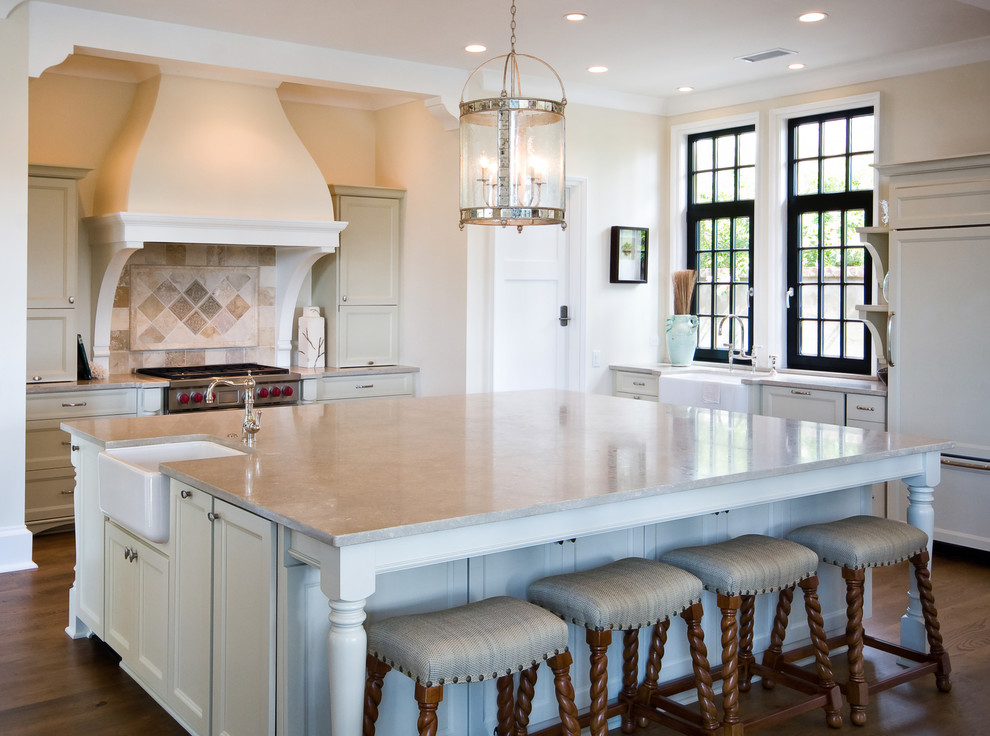 Traditional kitchen in Charleston with a farmhouse sink and panelled appliances.