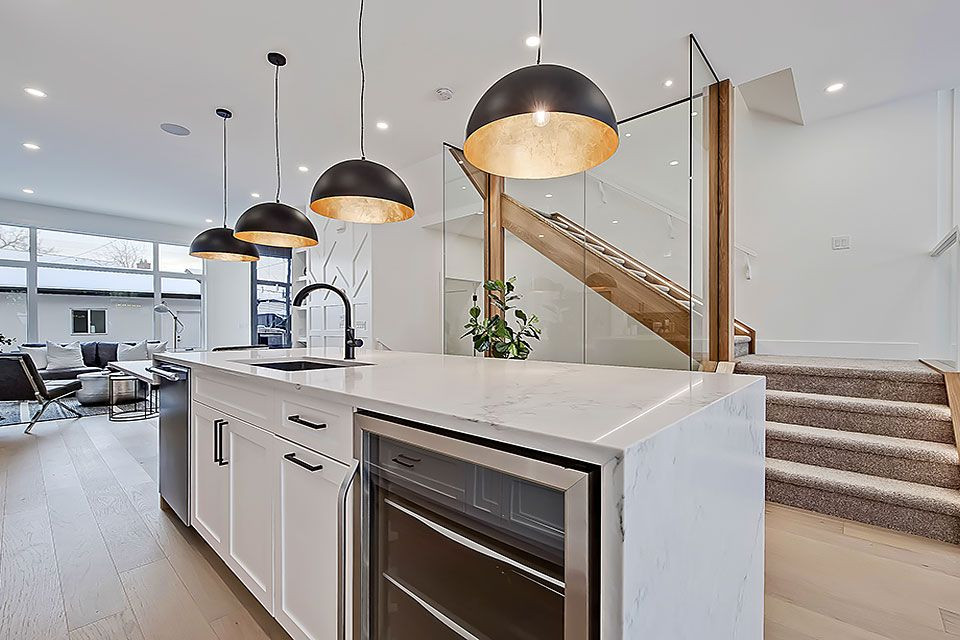 Example of a transitional home design design in Calgary