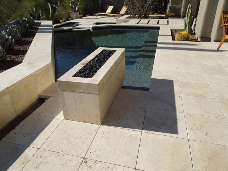 Photo of a mid-sized modern backyard patio in Phoenix with tile.