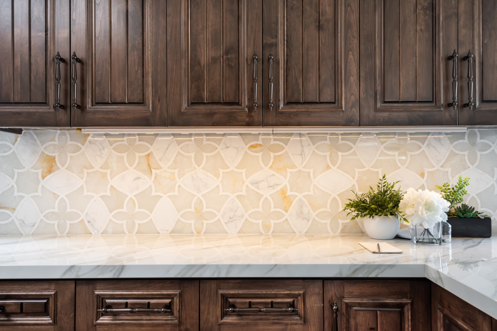 Photo of a large eat-in kitchen in Los Angeles with dark wood cabinets, marble benchtops, beige splashback, mosaic tile splashback, with island and yellow benchtop.