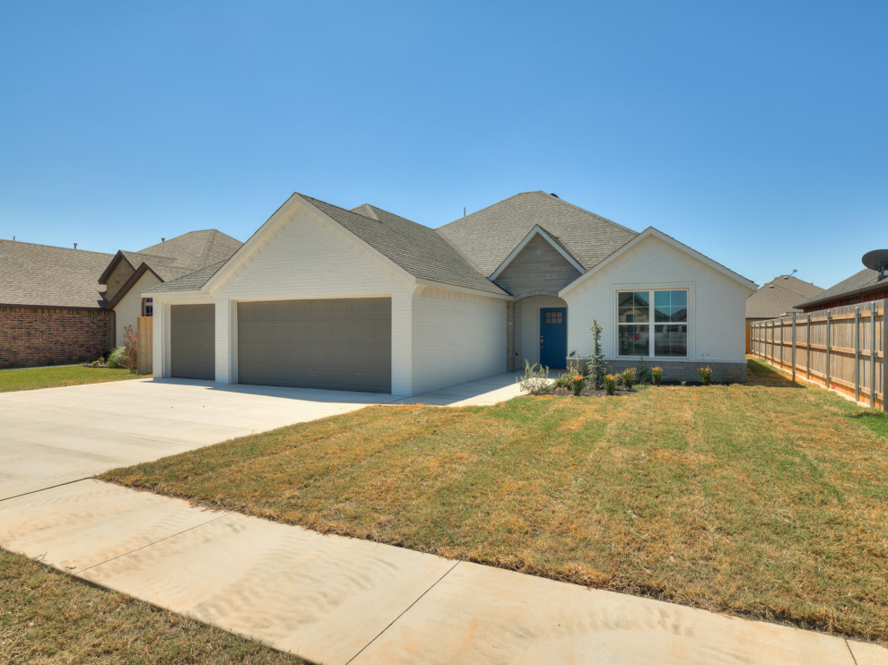 Neutral color brick 3 car garage