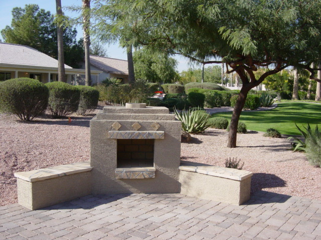 Inspiration for a small traditional full sun backyard concrete paver landscaping in Phoenix with a fire pit for winter.