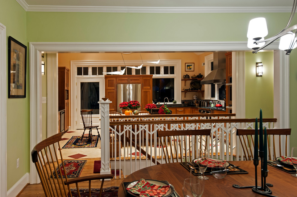 Mid-sized transitional open plan dining in DC Metro with green walls, medium hardwood floors, no fireplace and brown floor.