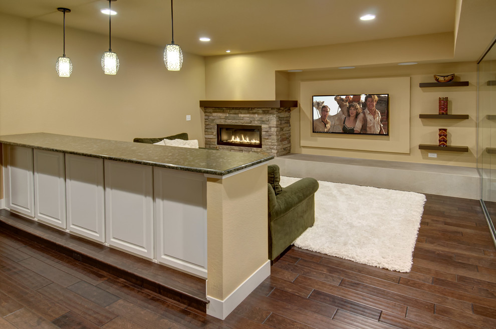Mid-sized transitional open concept family room in Denver with a home bar, beige walls, dark hardwood floors, a ribbon fireplace, a stone fireplace surround, a wall-mounted tv and brown floor.