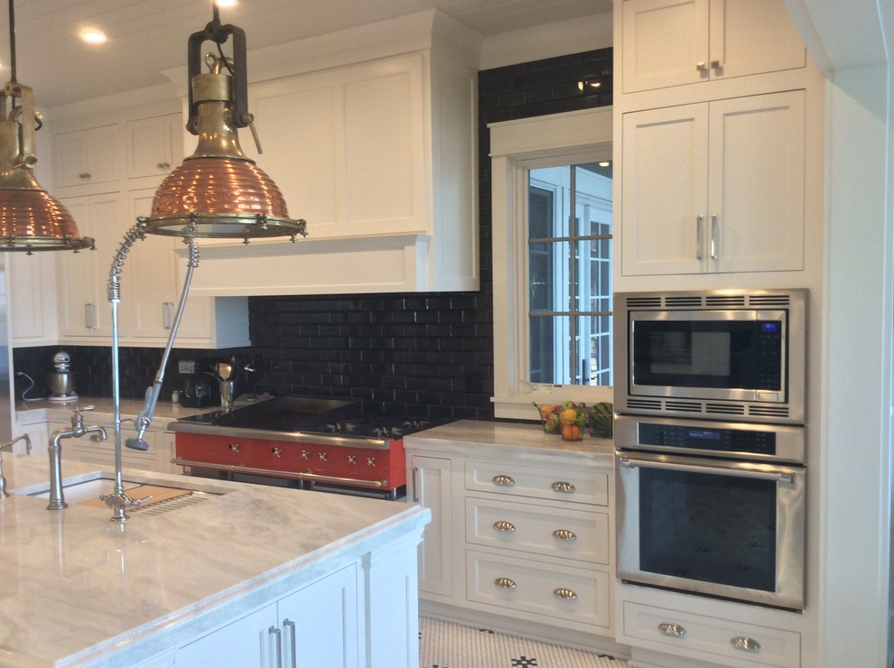 Mid-sized transitional l-shaped ceramic tile enclosed kitchen photo in Cedar Rapids with recessed-panel cabinets, white cabinets, stainless steel appliances, an island, a single-bowl sink, marble countertops, black backsplash and ceramic backsplash