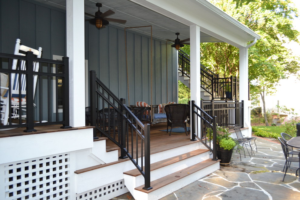 Inspiration for a small backyard deck remodel in Baltimore with a roof extension
