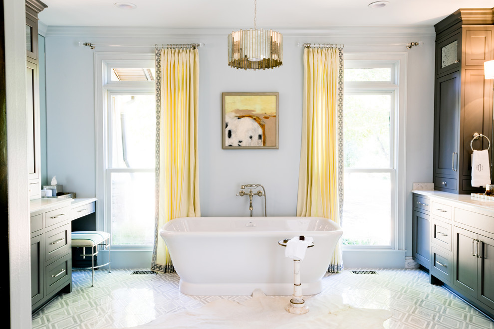 Large transitional master freestanding bathtub photo with shaker cabinets, gray cabinets, white walls, an undermount sink, quartz countertops and white countertops