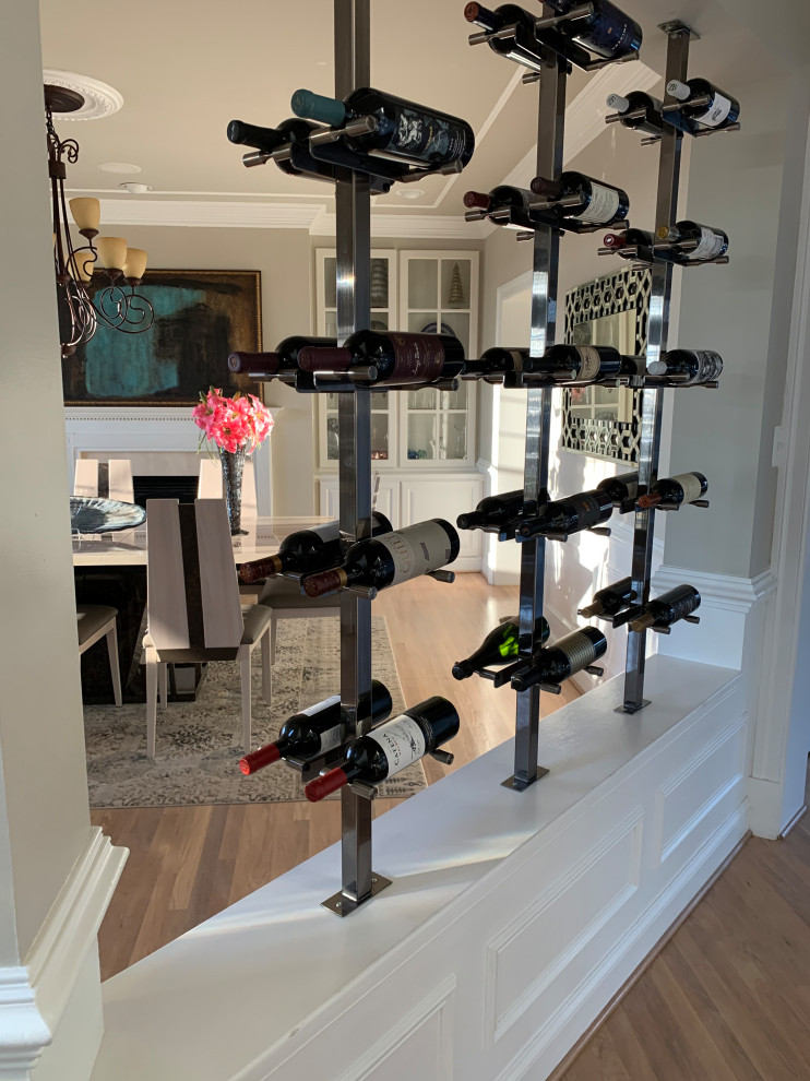 Contemporary wine cellar in Other with display racks.