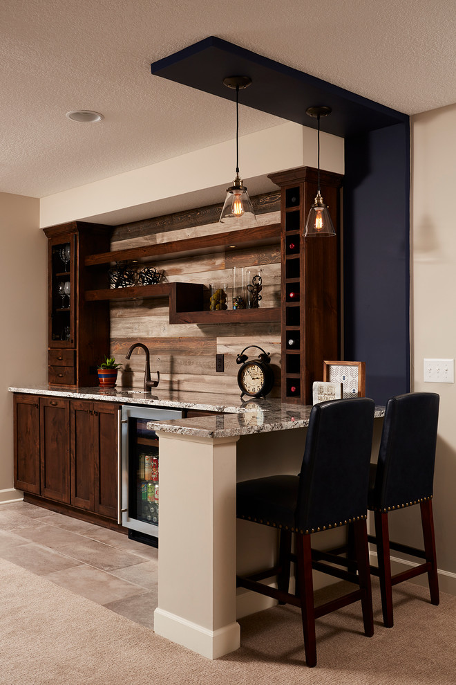 Photo of a mid-sized traditional l-shaped wet bar in Minneapolis with an undermount sink, recessed-panel cabinets, dark wood cabinets, granite benchtops, brown splashback, timber splashback and ceramic floors.