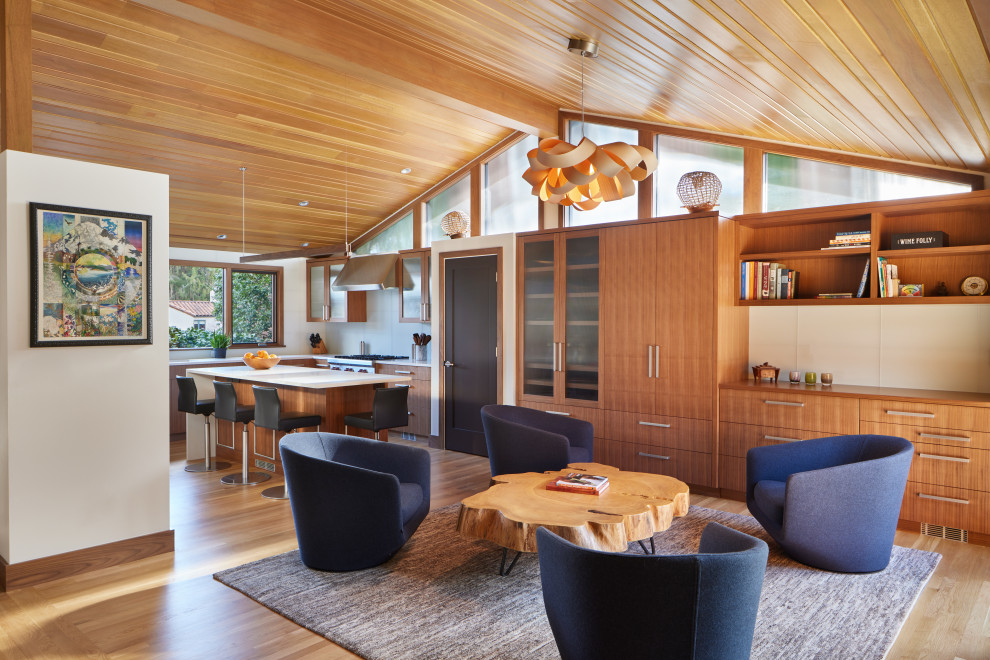Living room - mid-sized 1950s medium tone wood floor and wood ceiling living room idea in Seattle