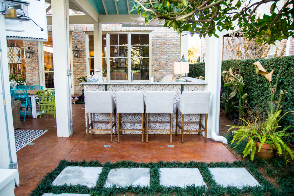 Photo of a beach style patio in New Orleans with a gazebo/cabana.