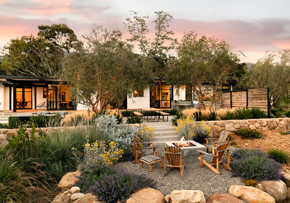 Inspiration for a large midcentury backyard full sun garden in Santa Barbara with a garden path and concrete pavers.