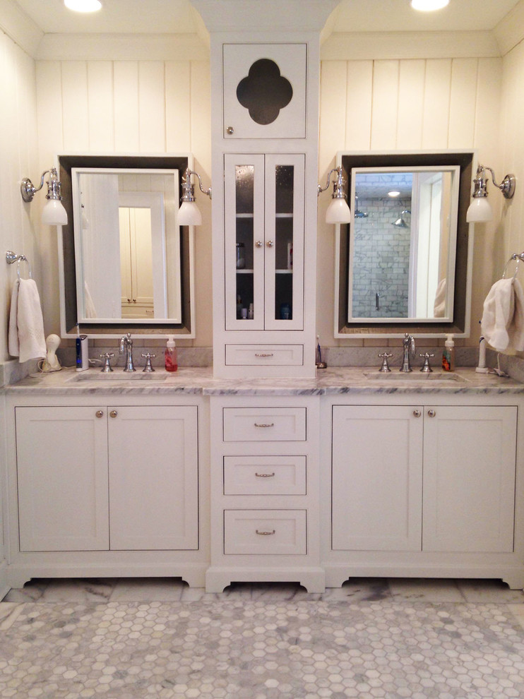 This is an example of an expansive arts and crafts master bathroom in Atlanta with an undermount sink, furniture-like cabinets, white cabinets, granite benchtops, a freestanding tub, a double shower, a two-piece toilet, white tile, ceramic tile, white walls and ceramic floors.