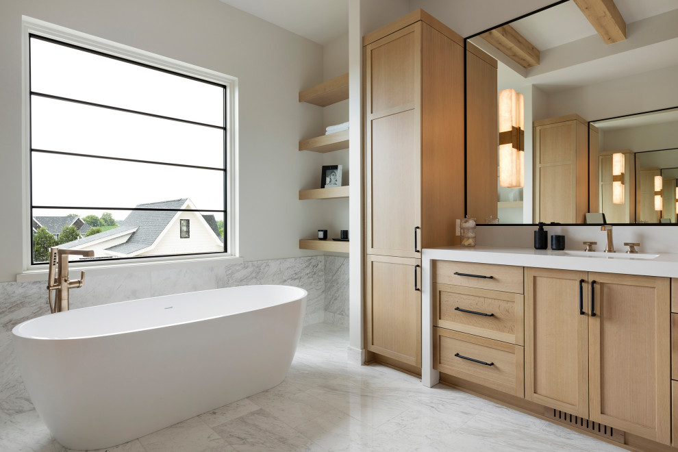 Inspiration for a traditional ensuite bathroom in Minneapolis with a freestanding bath, grey tiles, marble tiles, white walls, marble flooring, engineered stone worktops, grey floors, a hinged door, white worktops, an enclosed toilet, double sinks, a built in vanity unit and exposed beams.