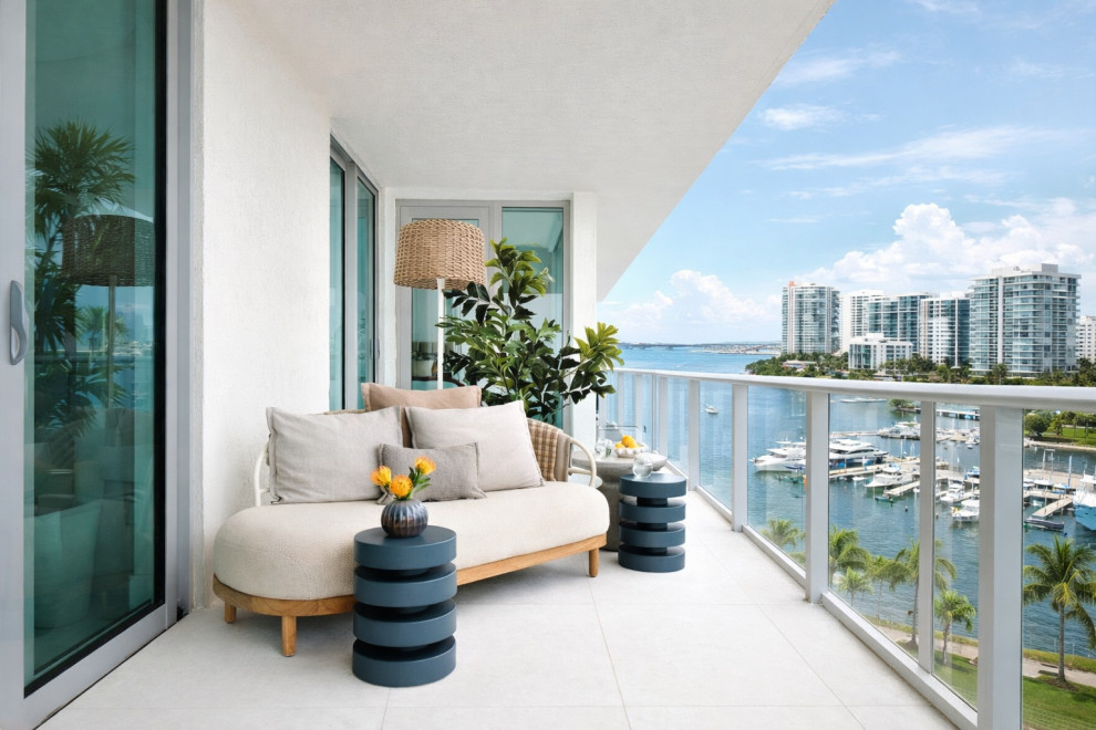 Modern coastal condo balcony overlooking Sarasota Bay, showcasing refined finishes and thoughtful Modern coastal condodesign typical of high-end condominium remodeling in Sarasota and Venice, Florida.
