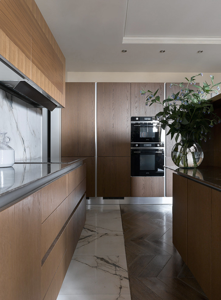 Small contemporary single-wall open plan kitchen in Moscow with flat-panel cabinets, medium wood cabinets, quartz benchtops, white splashback, porcelain splashback, porcelain floors, with island and white floor.