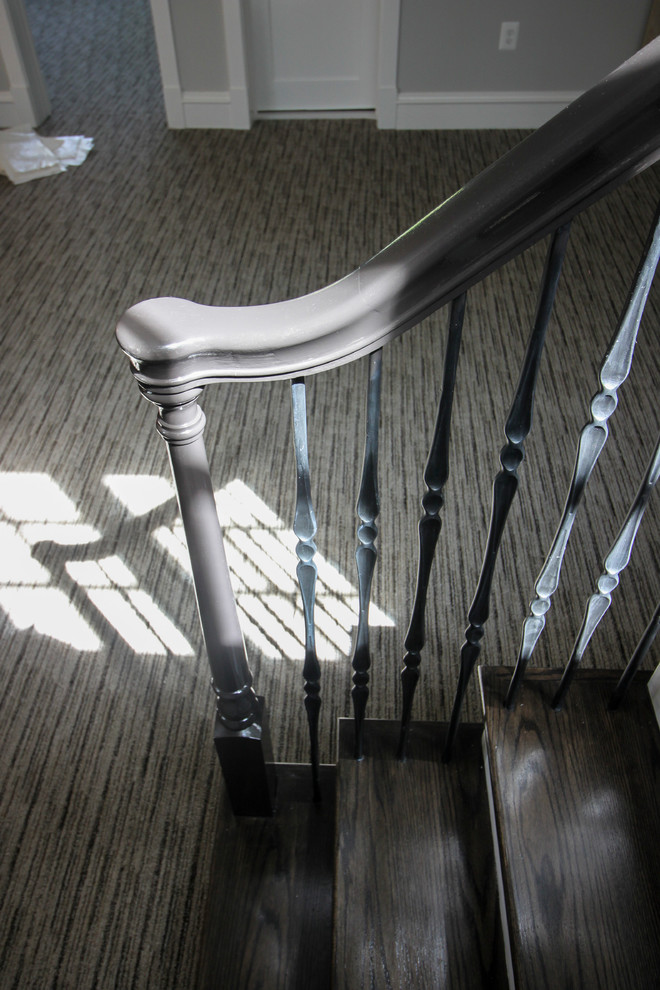 Inspiration for a large transitional wooden l-shaped mixed material railing staircase remodel in DC Metro with painted risers