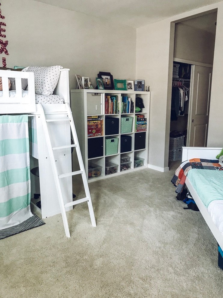 This is an example of a mid-sized gender-neutral kids' room in Denver with white walls, carpet and beige floor.