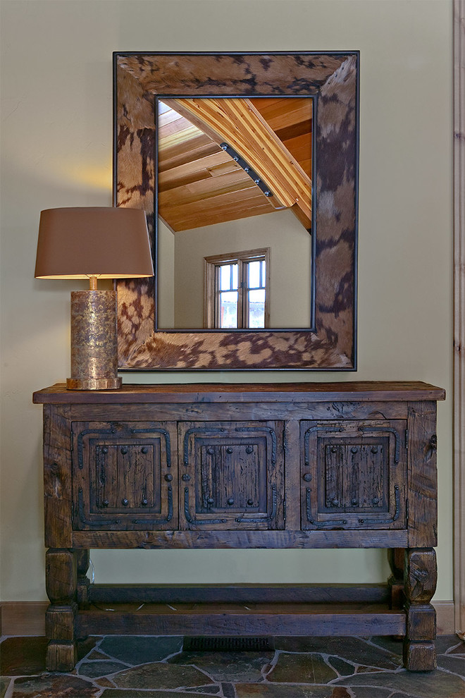 Mid-sized mountain style slate floor hallway photo with beige walls