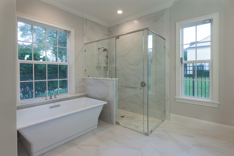 Mid-sized traditional master bathroom in Orlando with beaded inset cabinets, white cabinets, a freestanding tub, a corner shower, a two-piece toilet, gray tile, porcelain tile, grey walls, porcelain floors, an undermount sink and granite benchtops.