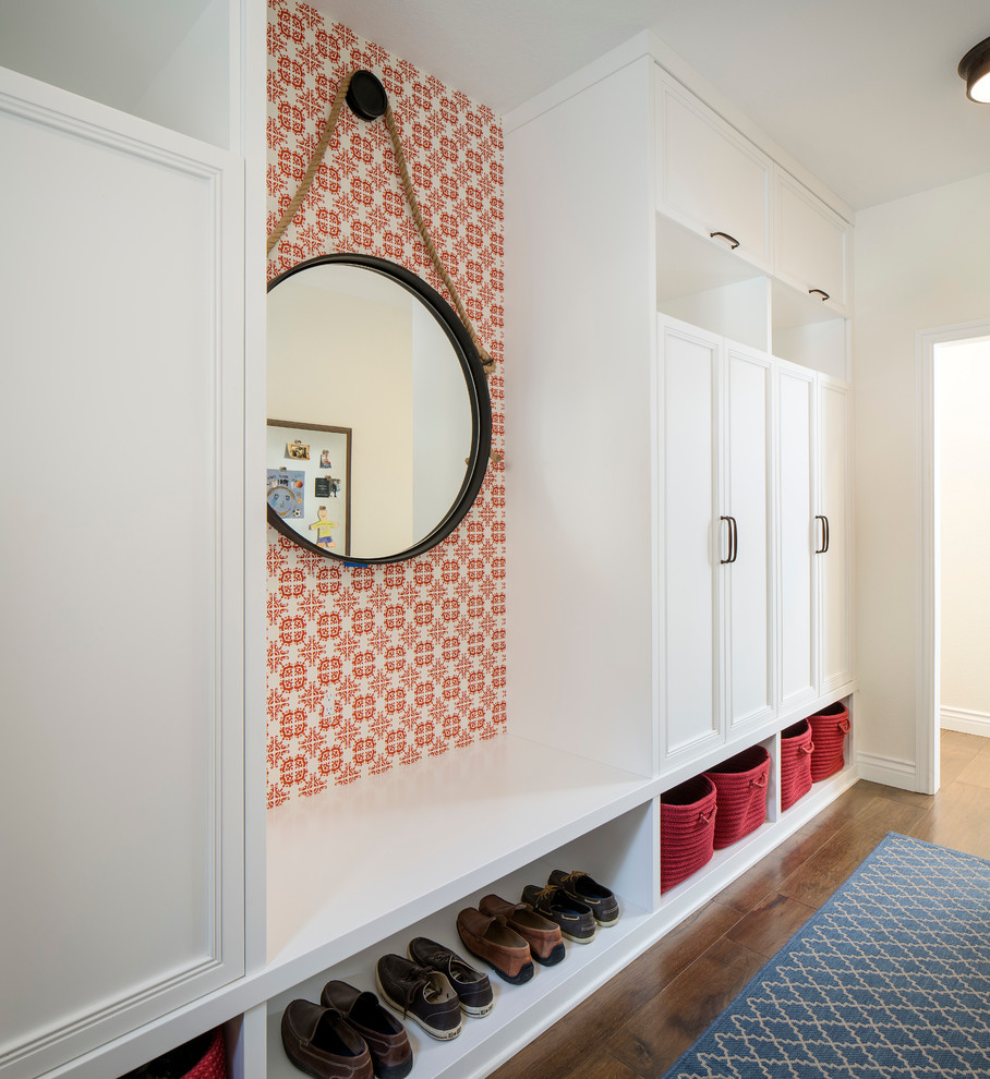 Inspiration for a large transitional mudroom in San Francisco with medium hardwood floors and white walls.