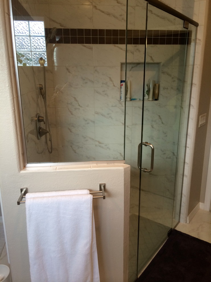 Inspiration for a mid-sized modern master white tile and stone tile marble floor walk-in shower remodel in Seattle with an undermount sink, shaker cabinets, dark wood cabinets, granite countertops, a two-piece toilet and gray walls