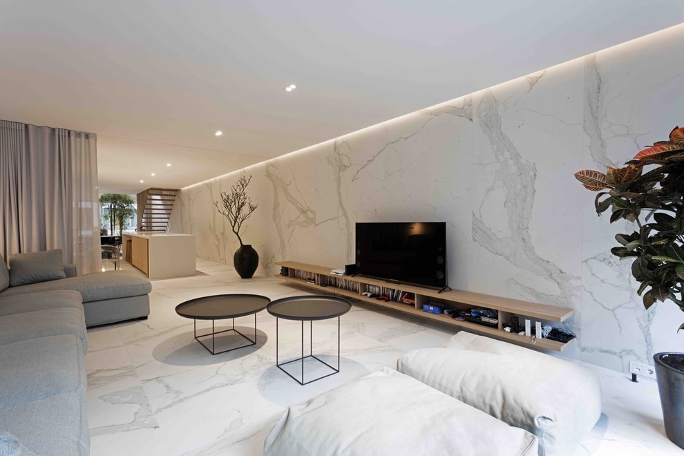 Inspiration for a contemporary formal open concept living room in London with multi-coloured walls and marble floors.