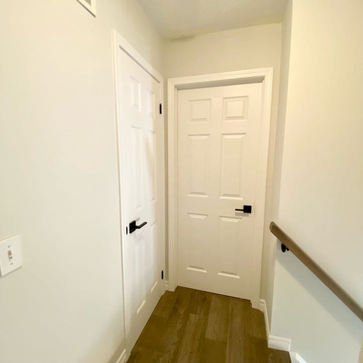 Example of a transitional wooden straight mixed material railing staircase design with wooden risers