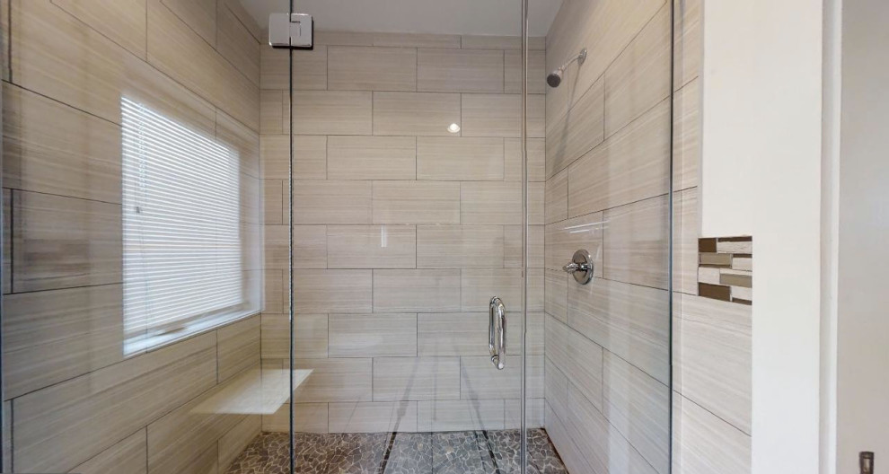 Large transitional master bathroom in Philadelphia with flat-panel cabinets, black cabinets, an alcove shower, a one-piece toilet, beige tile, ceramic tile, white walls, ceramic floors, an integrated sink, a hinged shower door, white benchtops, a single vanity and a freestanding vanity.