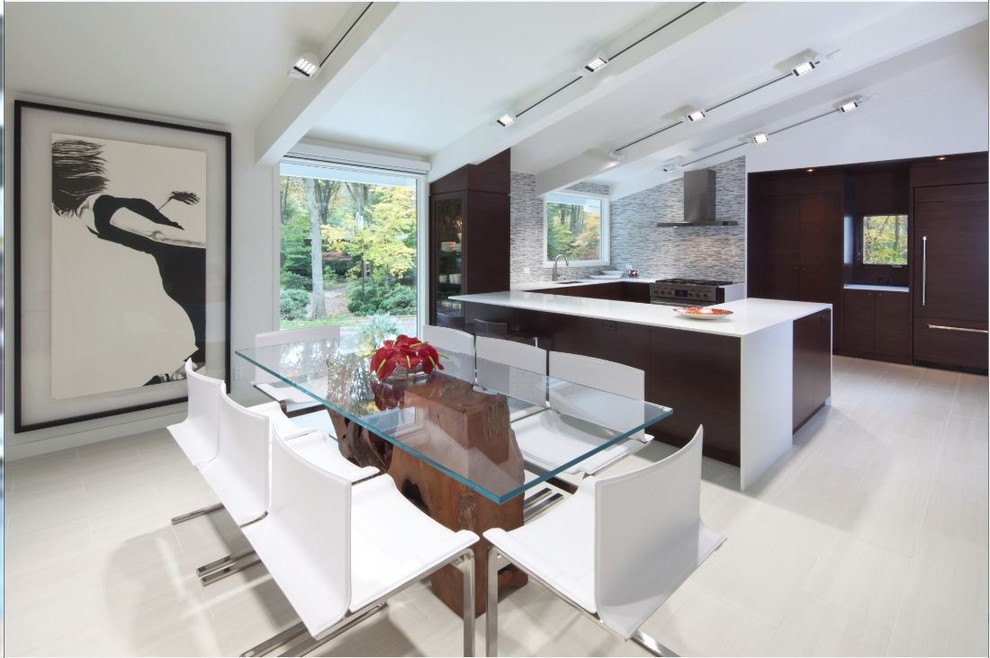 Inspiration for a large modern kitchen/dining combo in New York with white walls, porcelain floors, no fireplace and grey floor.