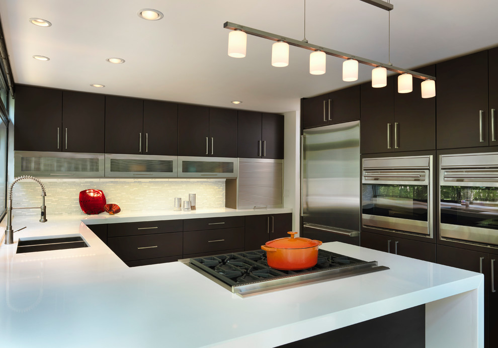 Inspiration for a mid-sized modern l-shaped enclosed kitchen remodel in Providence with an undermount sink, flat-panel cabinets, dark wood cabinets, quartz countertops, gray backsplash, matchstick tile backsplash, stainless steel appliances and no island