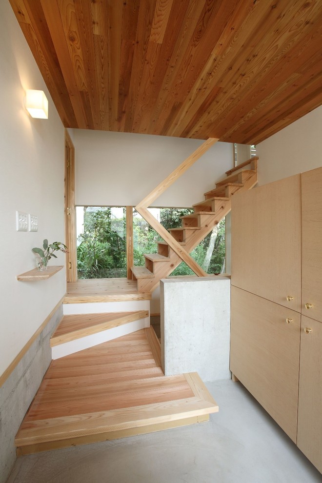 Photo of an asian wood staircase in Nagoya with wood railing.