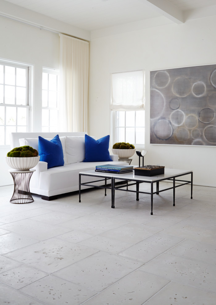 Photo of a large contemporary living room in Miami with concrete floors, no fireplace and white walls.