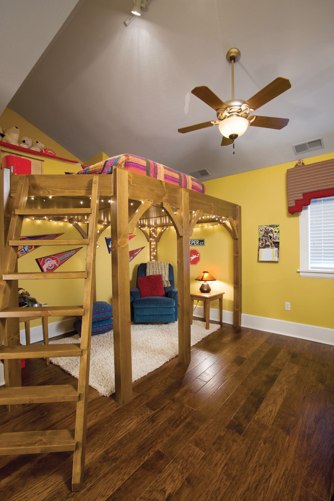Photo of a traditional kids' bedroom in Cleveland with yellow walls.