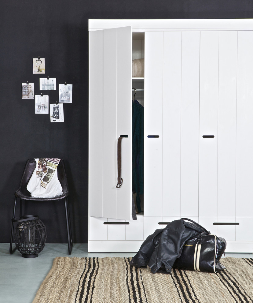 Design ideas for a scandinavian storage and wardrobe in Dorset with grey floor.