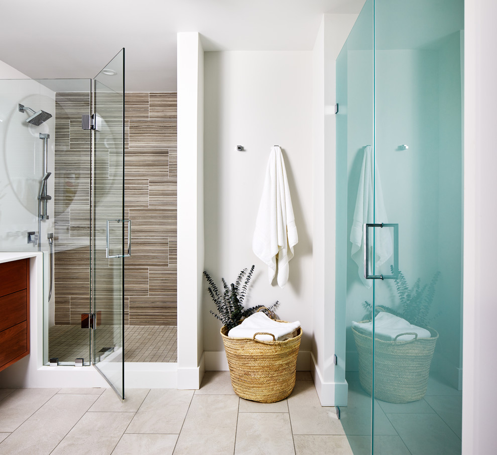 This is an example of a large midcentury master bathroom in DC Metro with furniture-like cabinets, medium wood cabinets, a corner shower, white walls, ceramic floors, a vessel sink, solid surface benchtops, grey floor, a hinged shower door and white benchtops.