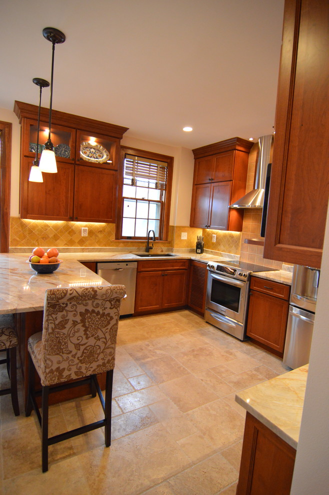 Inspiration for a mid-sized transitional u-shaped ceramic tile and beige floor eat-in kitchen remodel in DC Metro with an undermount sink, shaker cabinets, medium tone wood cabinets, granite countertops, yellow backsplash, ceramic backsplash, stainless steel appliances and beige countertops