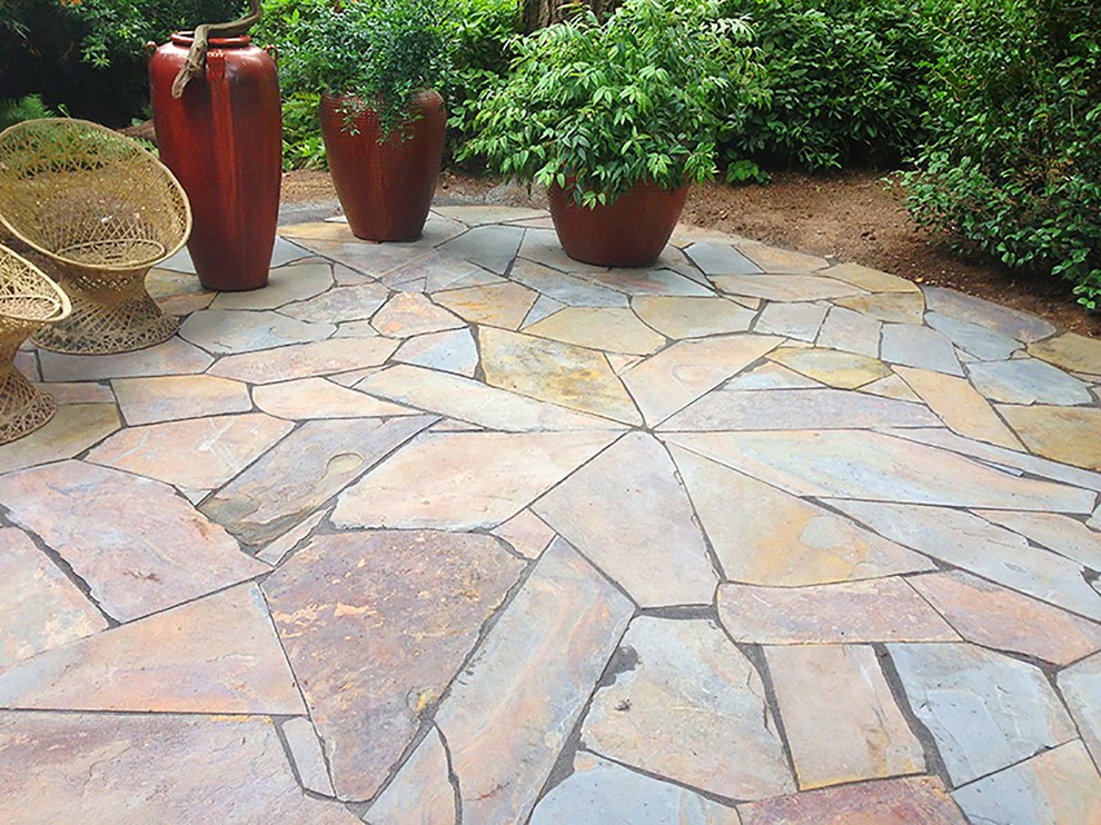 Design ideas for a small contemporary backyard full sun garden for spring in Seattle with natural stone pavers.