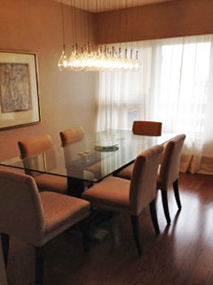 Small traditional enclosed dining room in Ottawa with beige walls and medium hardwood flooring.