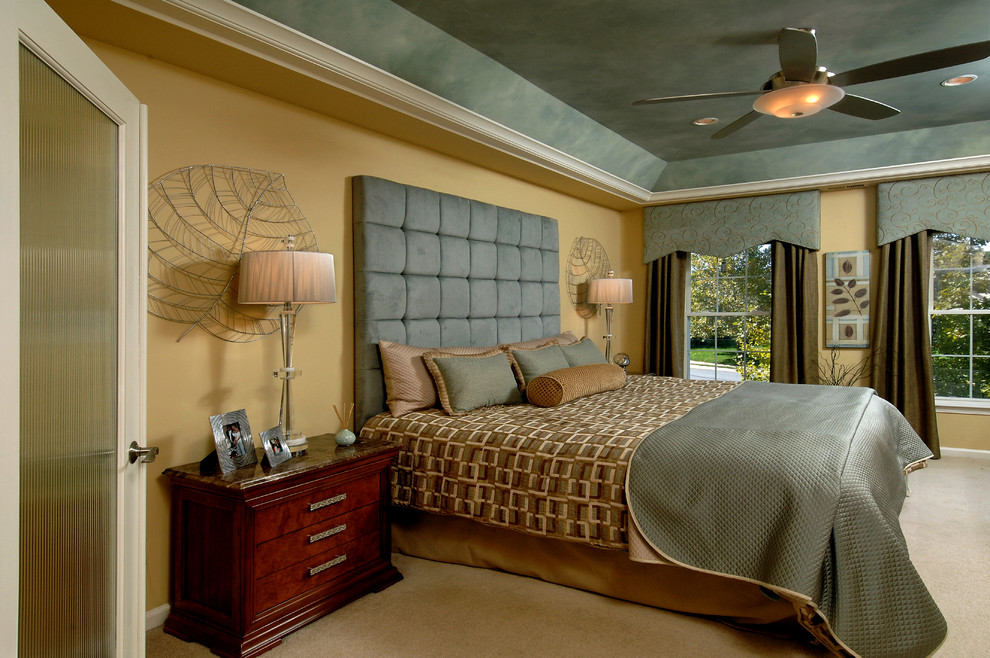 Photo of a traditional master bedroom in DC Metro with beige walls, carpet and no fireplace.