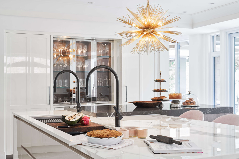 Eat-in kitchen - large contemporary l-shaped eat-in kitchen idea in Ottawa with two islands, an undermount sink, shaker cabinets, white cabinets and white countertops