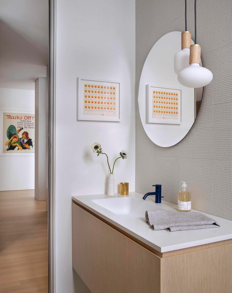 Inspiration for a medium sized modern cloakroom in Chicago with flat-panel cabinets, medium wood cabinets, medium hardwood flooring, a submerged sink, engineered stone worktops, white worktops and a built in vanity unit.