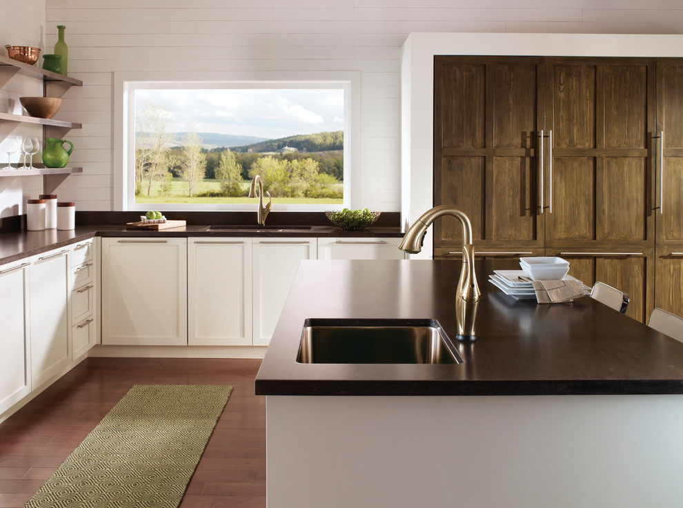 Inspiration for a transitional medium tone wood floor kitchen remodel in Indianapolis with an undermount sink, shaker cabinets, white cabinets, white walls and an island