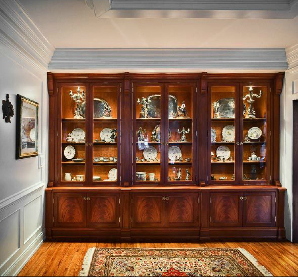 Inspiration for a medium tone wood floor dining room remodel with white walls and no fireplace